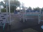 Children's climbing frame across multiple levels and stretching vastly across the play area on the soft surface floor covering. Located centrally in the public park.