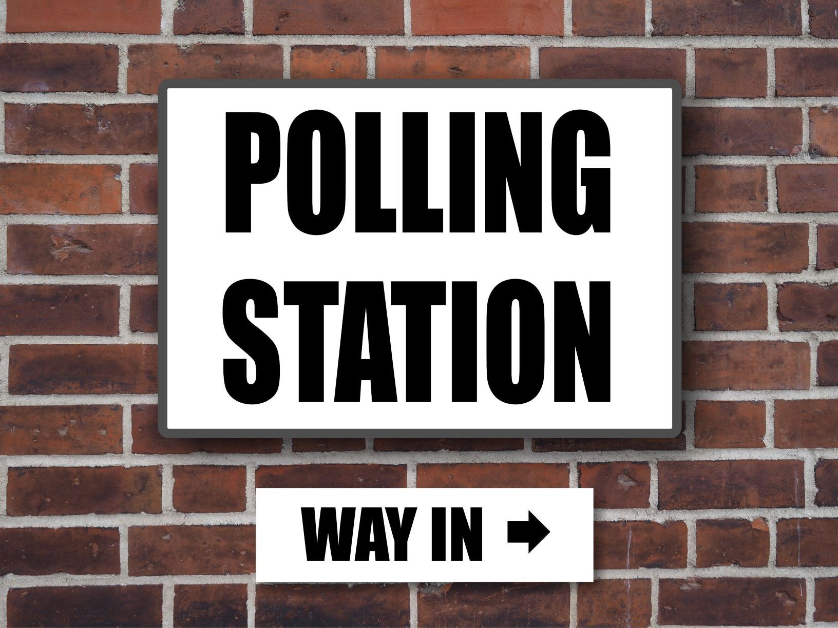 polling station sign attached to wall