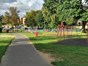 Children's paly area located to the left of the footpath through the meadows park.