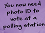 Purple post-it note with the words "you now need photo ID to vote at a polling station".