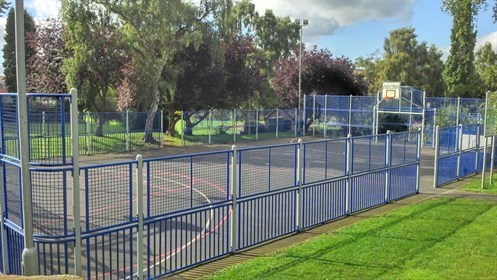 park with hardstanding area, marked out for various sports such as basketball paly area, cricket, and football.