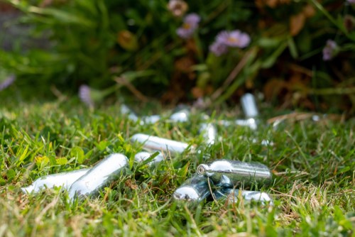 Laughing gas canisters on grass