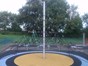 A climbing net within the children's play area and painted soft surface floor covering.