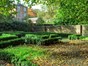 low rise hedges form the formal garden area within the public gardens and borders the winding maze like footpath