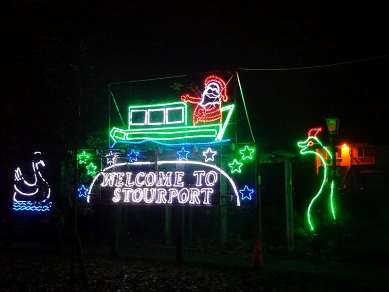 Christmas lights of Santa in a boat with the words Welcome to Stourport all in a range of coloured christmas lights