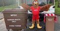 Kiddeminster Harriers mascot Harry and a brown garden waste bin