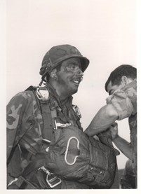 solider with parachute pack sepia photo