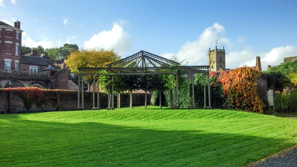 An outdoor wooden framed theatre located in the far corner of the public gardens. It is green and takes it's name of the Green Theatre. Behind the open-framed theatre are high pre-war walls which providea solid backdrop to the open air theatre.