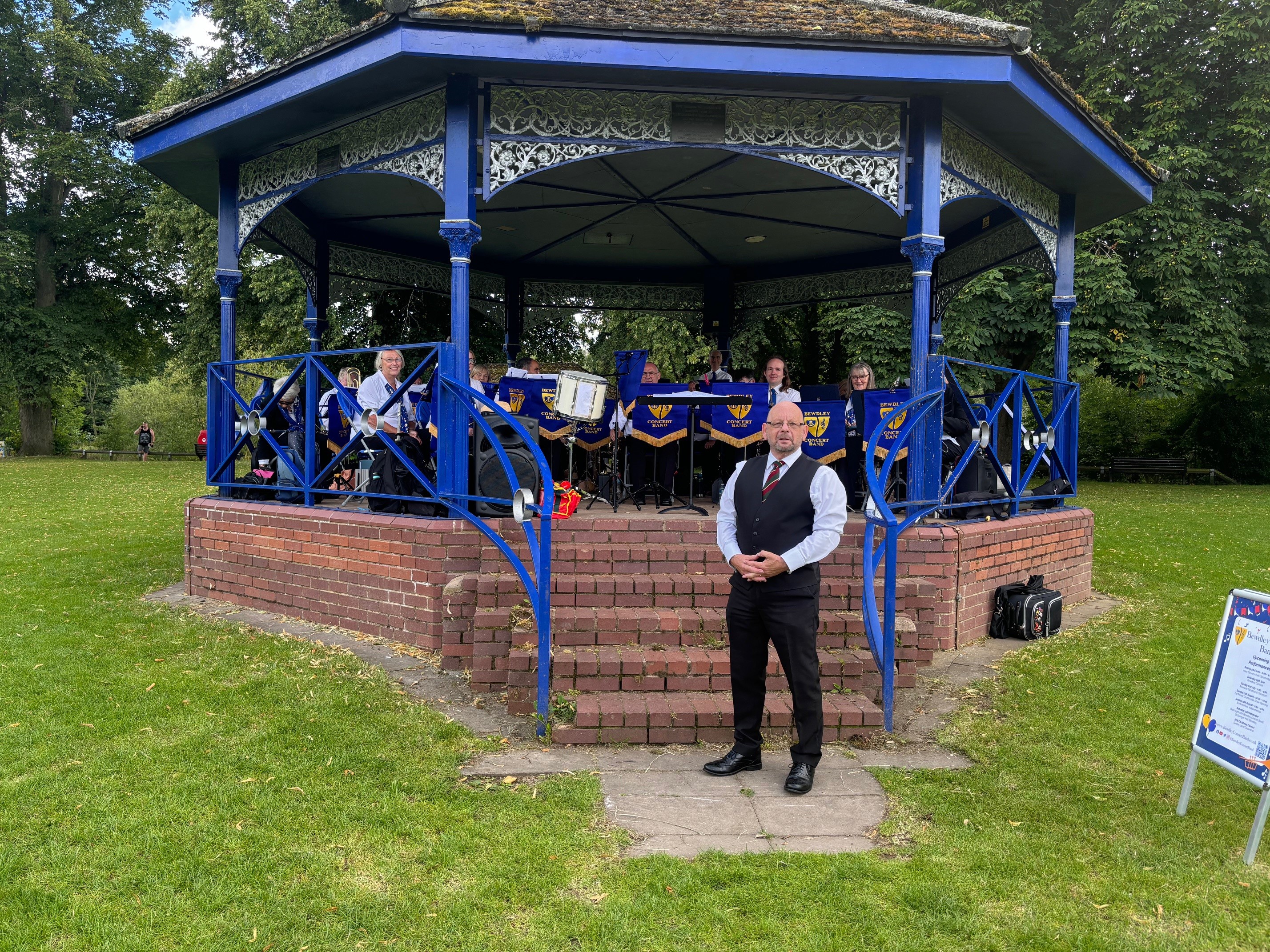 Bewdley Concert Band performing in the bandstand at Riverside Meadows park in Stourport. 
