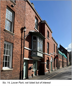 long terrace of red brick buildings