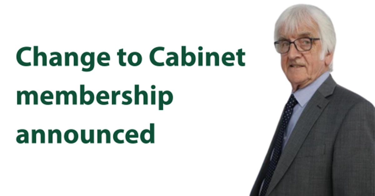 Man with grey hair in a suit. Wording says Change to Cabinet membership announced.