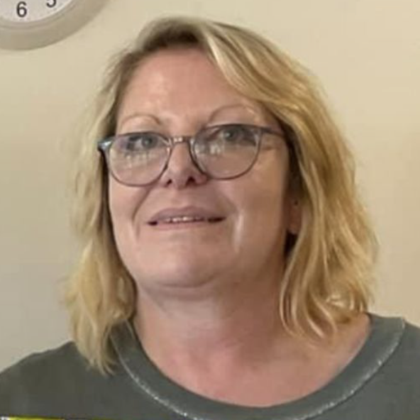 Headshot of female councillor: blonde hair and wearing glasses