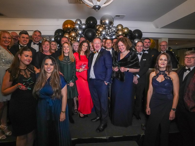 A group of business people smartly dressed for an awards evening