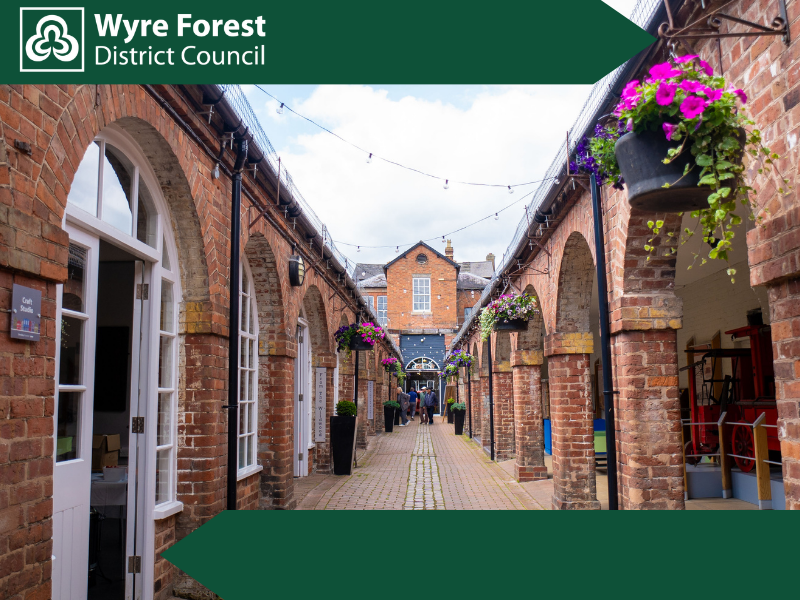 A walkway between two brick buildings