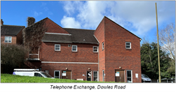 large angular red brick building