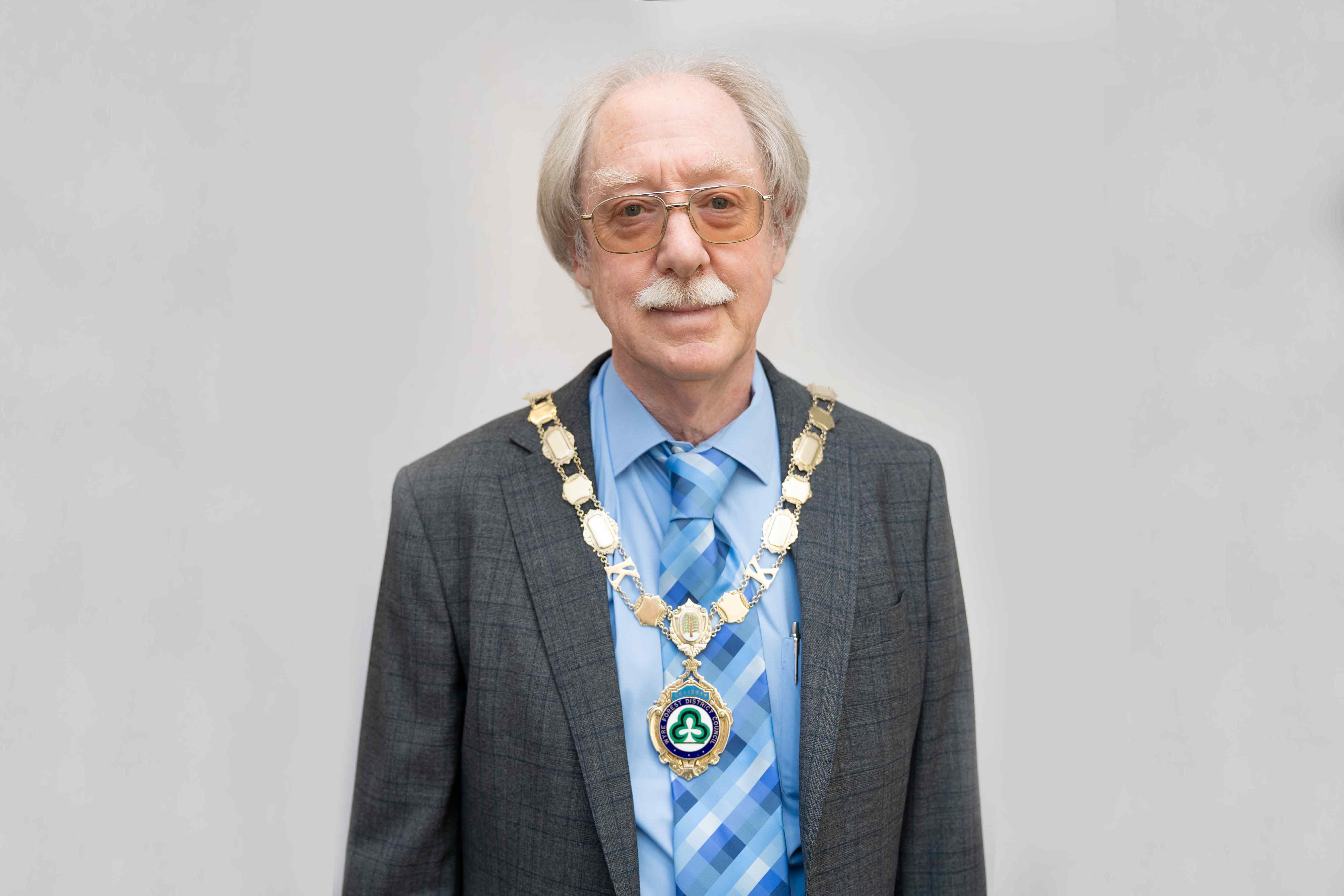 Photograph of man on grey background