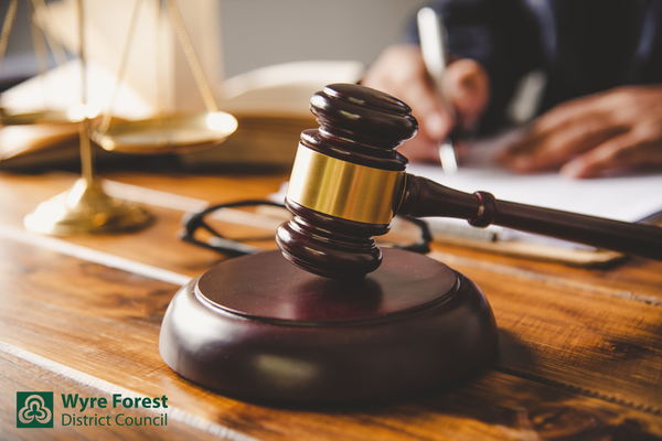 A wooden gavel on a desk