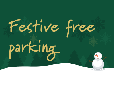 Festive free parking in yellow on a green background. There is a snowy landscape with a snowman.