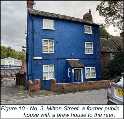 large blue painted old brick building