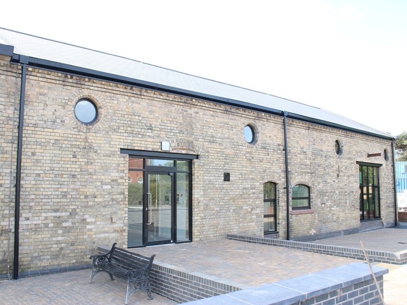 large brick and glass fronted building