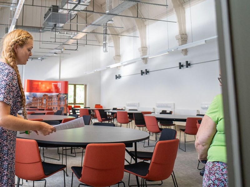 A person talking in a large room