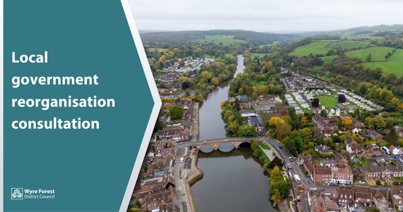 Drone shot of a river and surrounding town. 