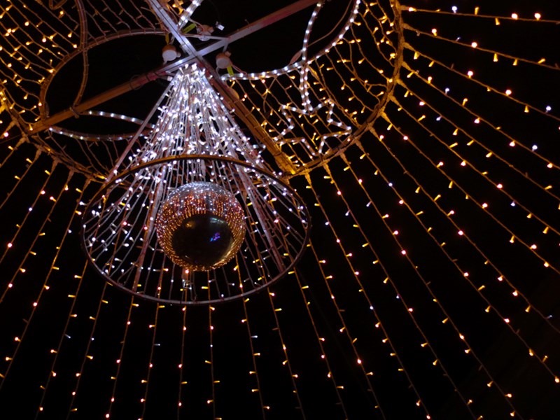 A spiral of yellow and white christmas lights