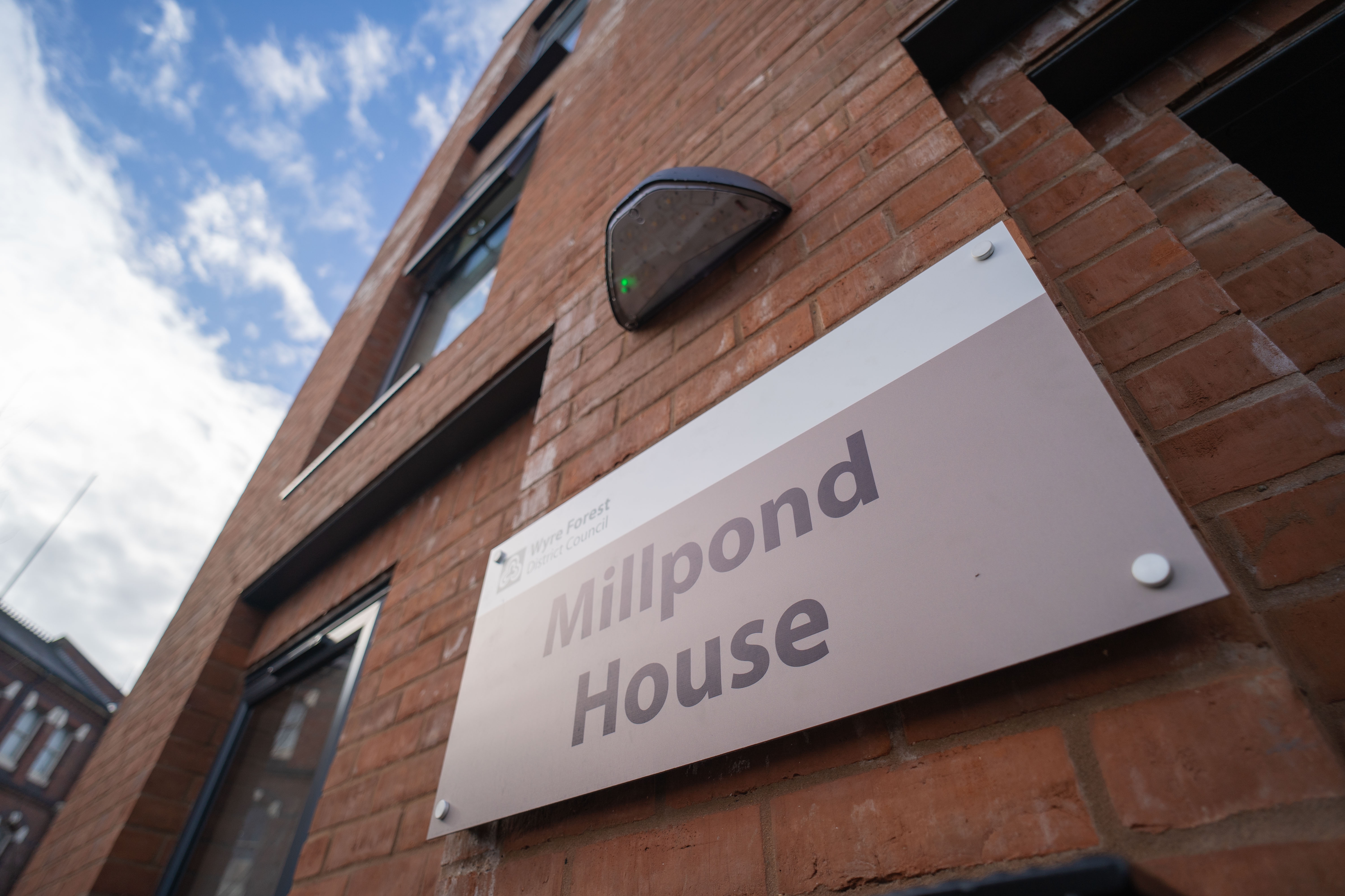 Building name sign with Millpond House written on it