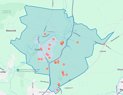high level map of village showing outlined boundary area with red dots where properties are for sale