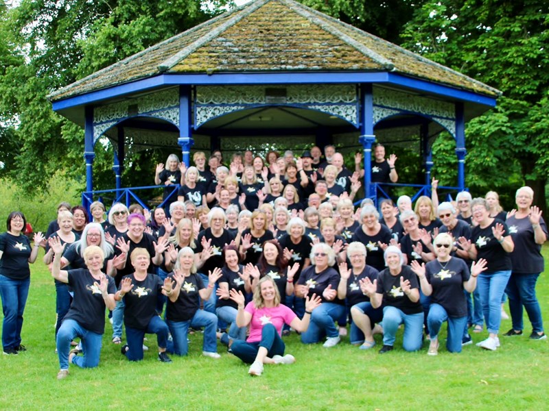 Image of the members of the Got to Sing choir standing on and in front of the bandstand at Stourport Riverside