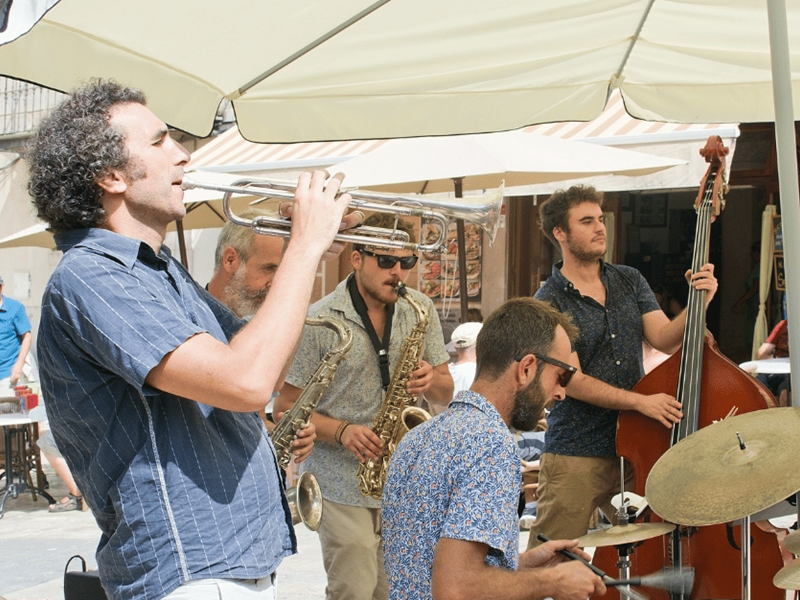 Band of musicians performing outdoors