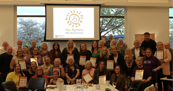 Photograph of a group of people at an awards ceremony