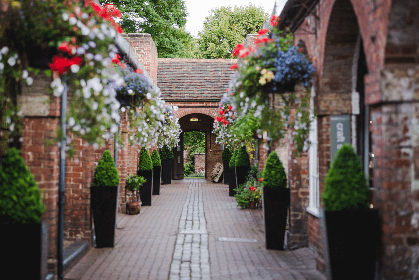 view of a walkway through older buildings in a museum