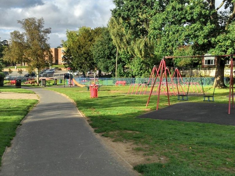 Children's paly area located to the left of the footpath through the meadows park.
