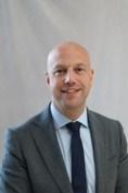 headshot of man in suit