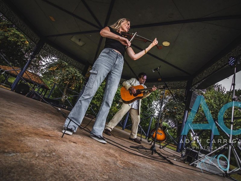 Image of the the band called The Jamesons performing in the bandstand at Riverside Meadows Stourport with grass in front and trees behind