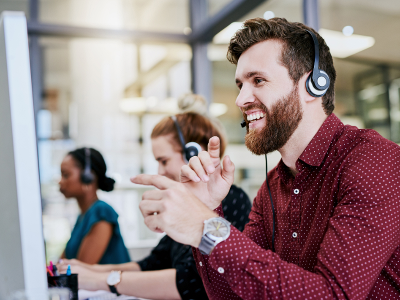 A man wearing a headset in an office