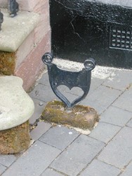 ornate metal shoe scraper