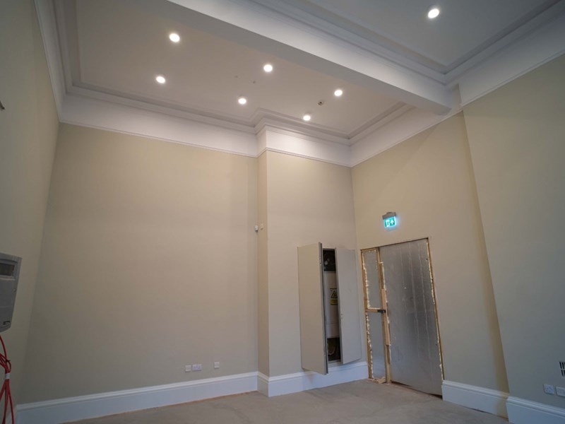 A room with spotlights within the ceiling