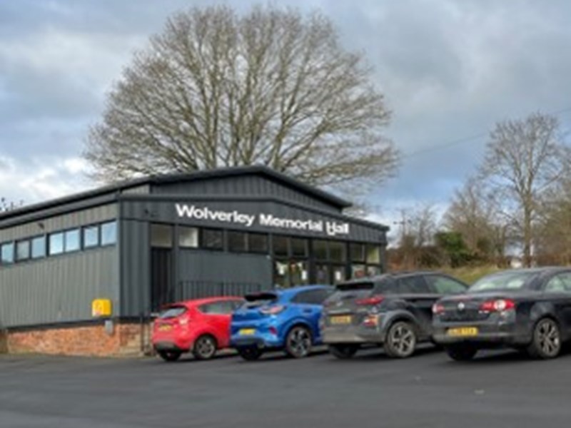 exterior of new looking village hall and car park