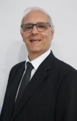 headshot of man in suit