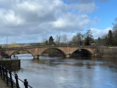 3 arched brick bridge spanning river