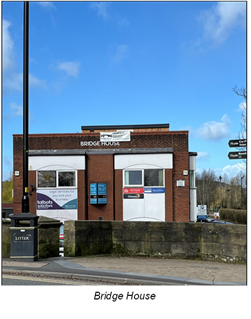 red brick building with large advertisements under windows