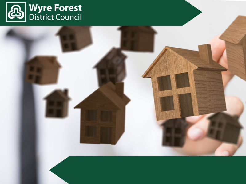 Wooden model houses suspended in the air