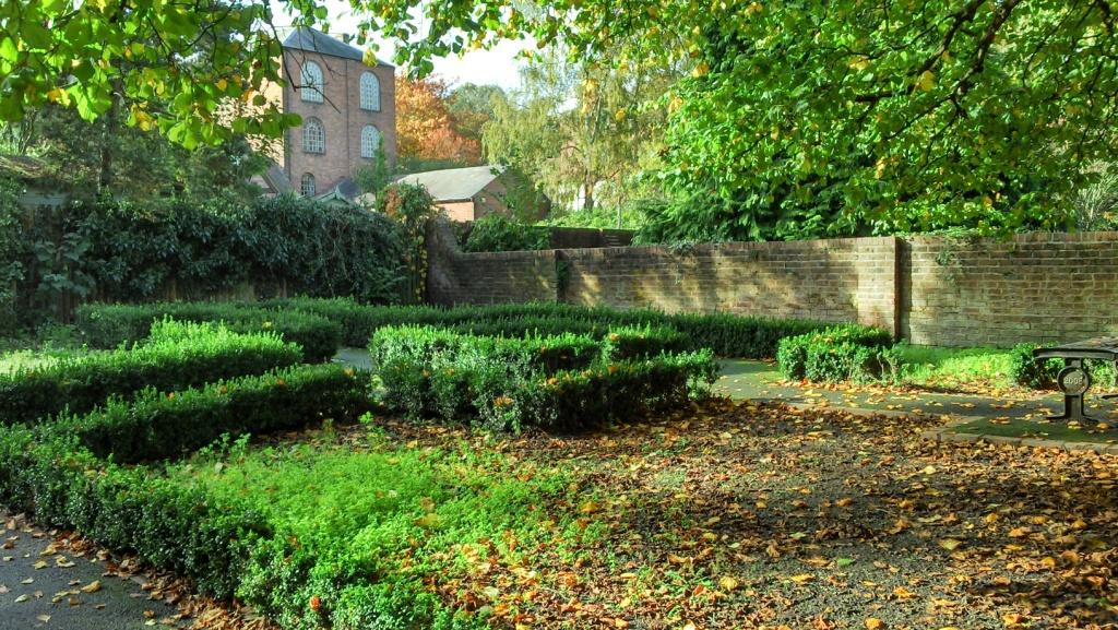 low rise hedges form the formal garden area within the public gardens and borders the winding maze like footpath