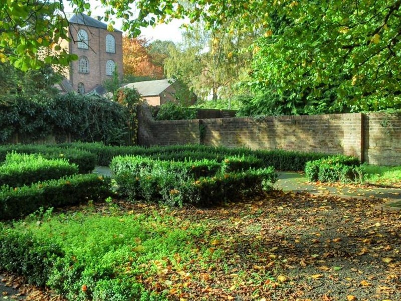 low rise hedges form the formal garden area within the public gardens and borders the winding maze like footpath